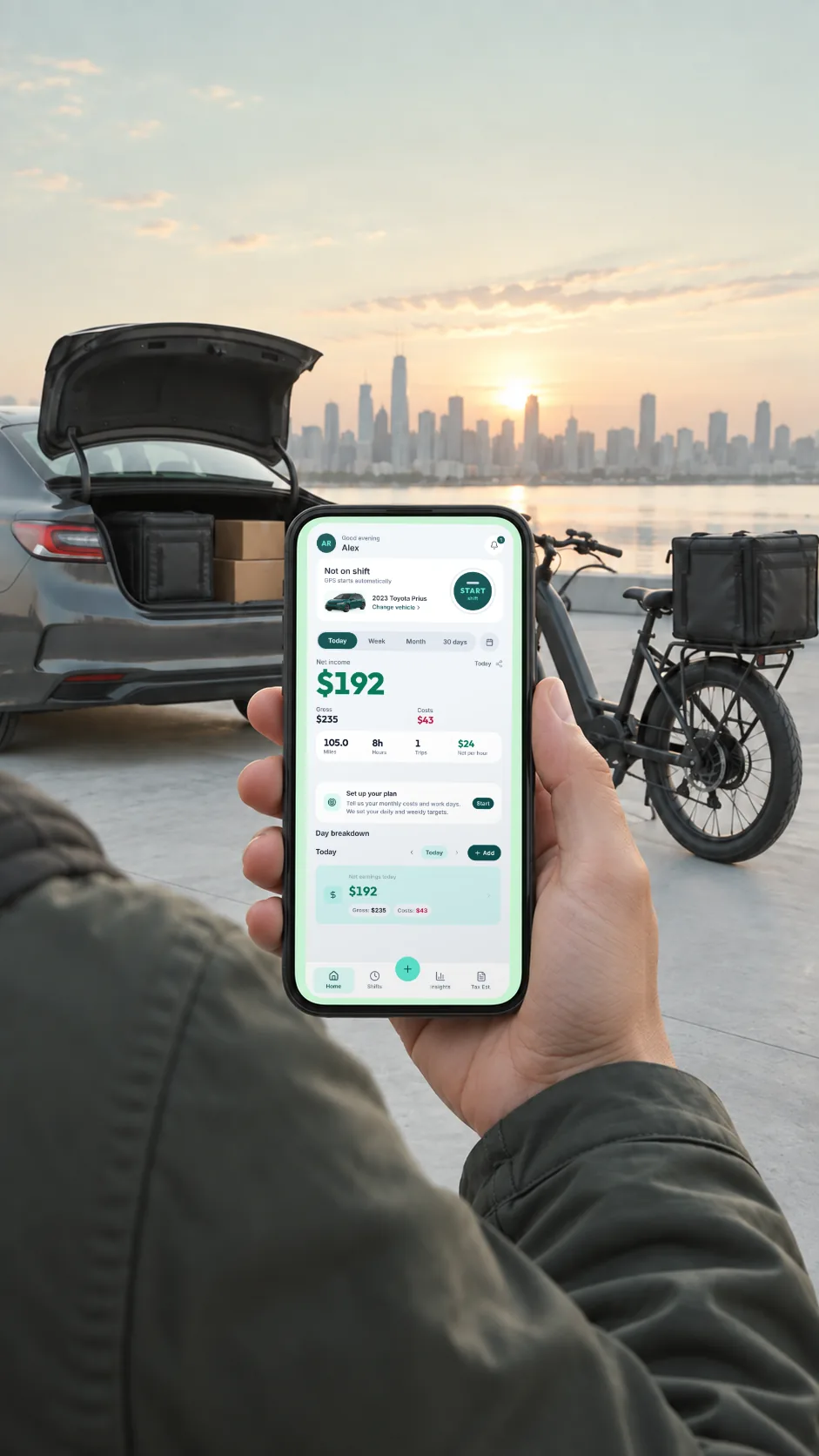 A driver at dawn holding a phone showing the GigMiles Home screen: Net income $192 today from $235 gross and $43 costs, 105.0 miles, 8 hours, $24 per hour. Behind the phone, a sedan with its trunk open holding a delivery bag and parcels, and an e-bike with a delivery box. Example inputs, not a customer’s earnings.